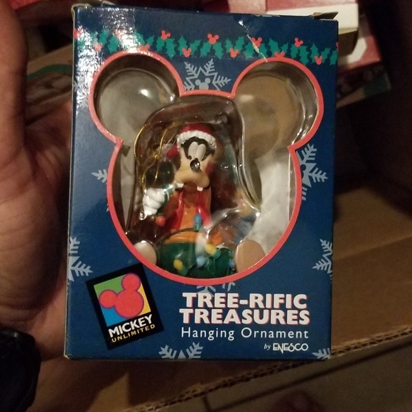 About 200 or more keepsake disney and halmark ornaments in box